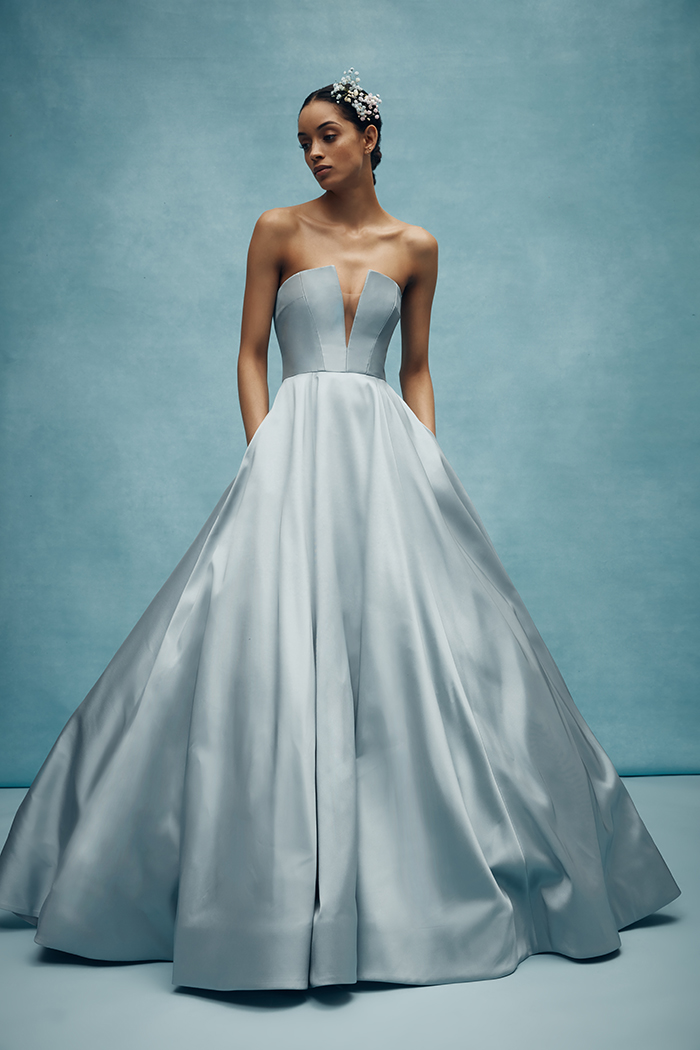 Fall in love with Anne Barge's architecturally seamed V-notched bodice with full ballgown skirt of mikado scuba. Emory comes in a steel blue tone. Emory by Anne Barge