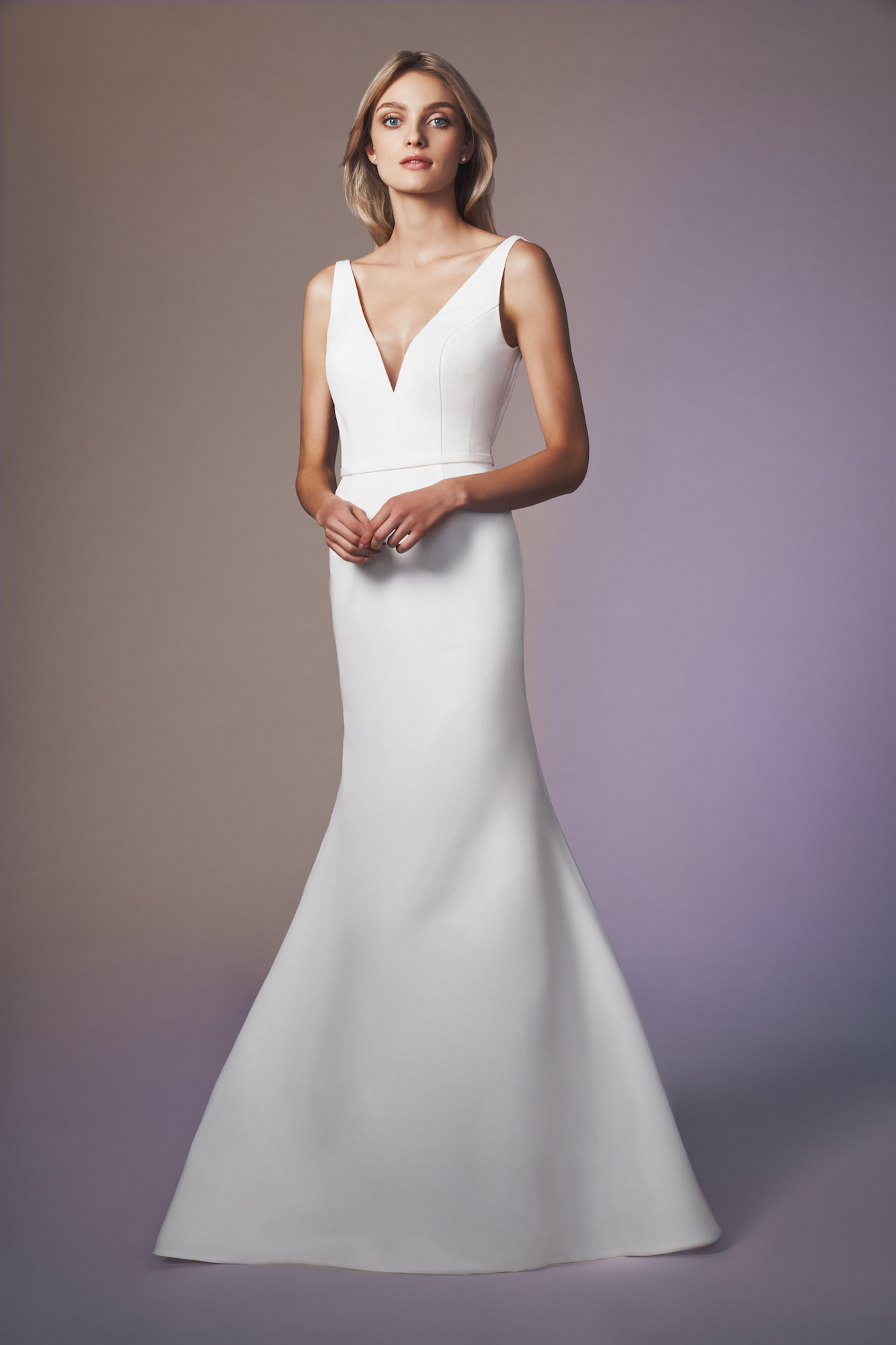 V-neck fit and slightly flared gown of faille accented with low V pleated back bodice The Moet gown is made to order. Please allow 16 weeks for delivery. Rush options may be available. Please contact an Expert stylist to confirm.