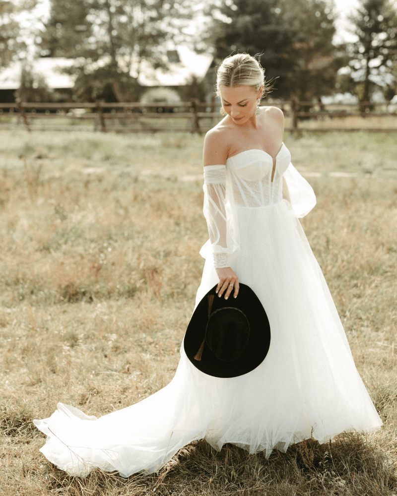 Strapless a-line tulle bridal gown and detachable sleeves